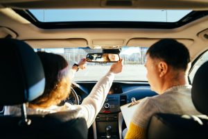 Two people in a car during a driving lesson